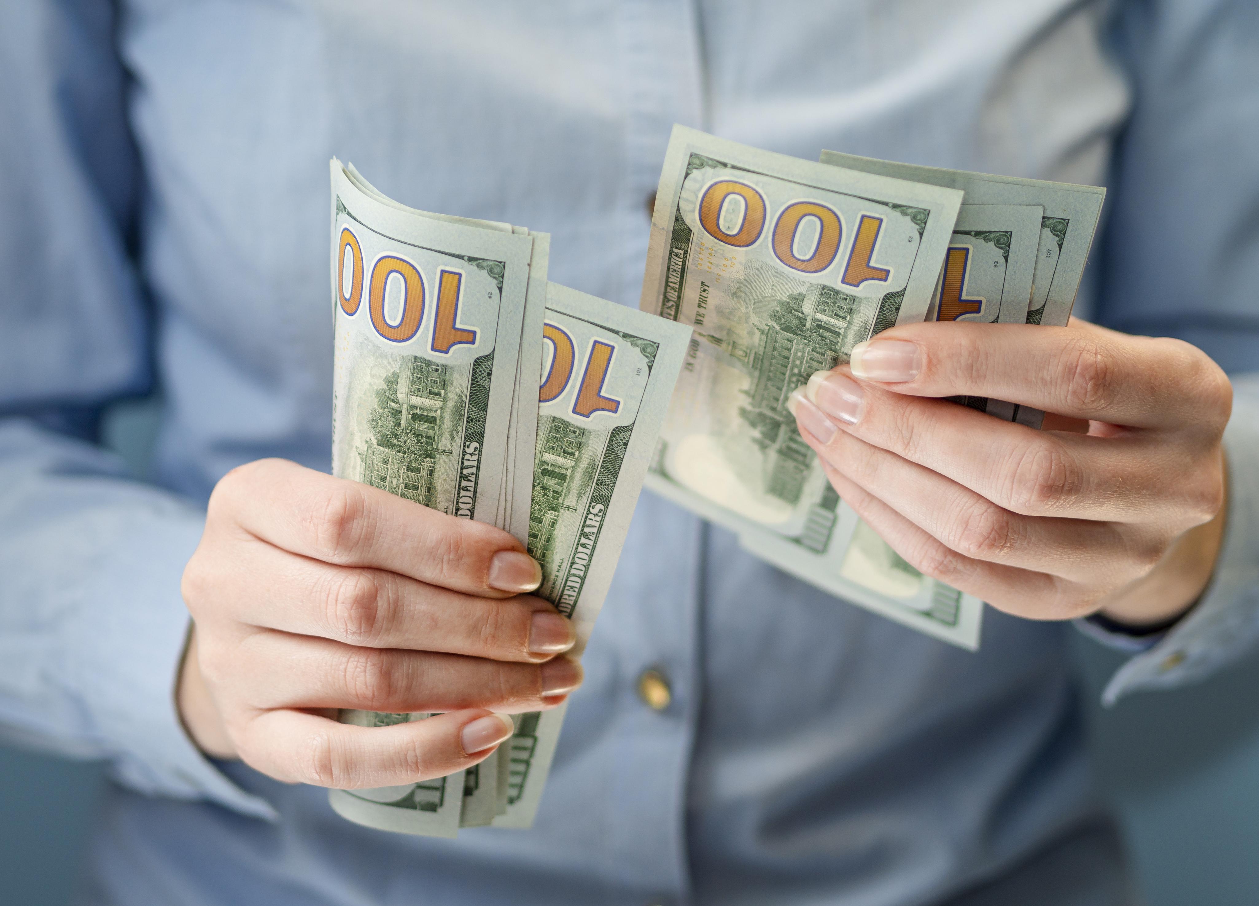 front-view-person-holding-money